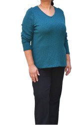 Petrol knit elastic blouse with V-neck and long sleeves, styled with black trousers - plus size
