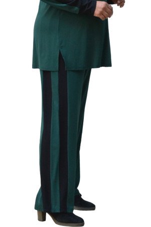 Effortless style in plus-size green pants with sporty black stripes.