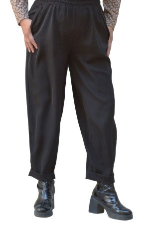 Black crepe pants with elastic waist, pockets and cuffed hem, styled with printed blouse - plus size
